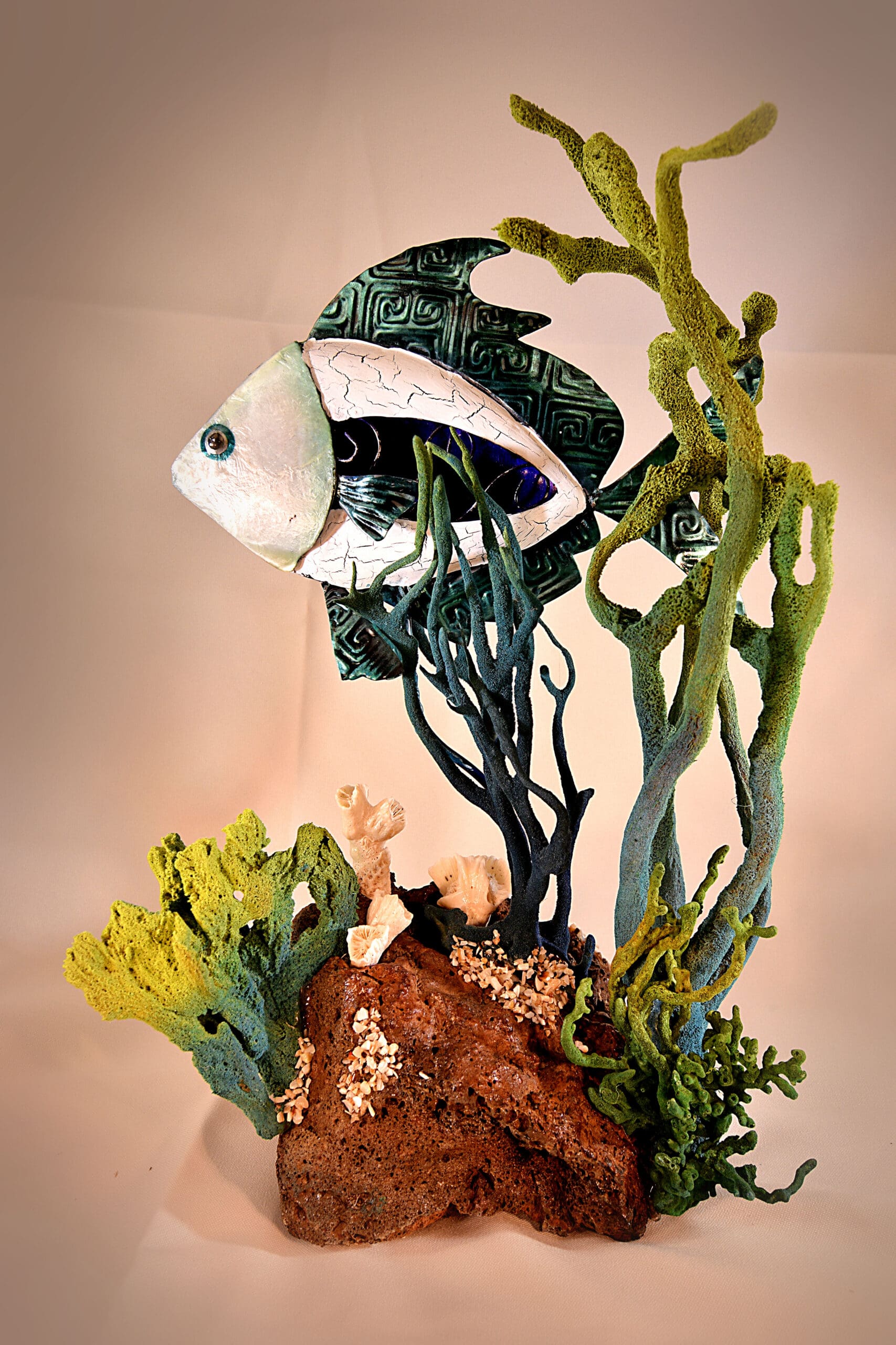 Fish blue metal on lava rock